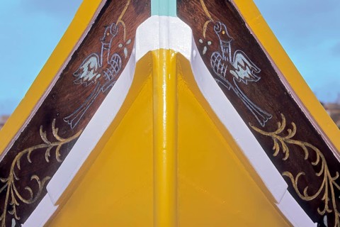 Part of bow of fishing boat with typical colourful painting for Maltese fishing boats, Valletta,