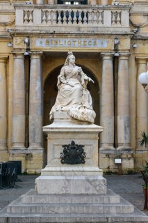 Marble statue of Queen Victoria of Great Britain in front of entrance to National Library of Malta