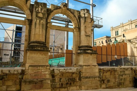 View through former arched window of ruins of former opera house Royal Opera House of Valletta