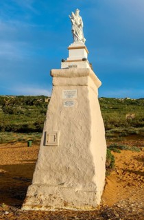 Statue of Madonna Maria Mother of God on Ramla Bay beach, Gozo Island, Malta