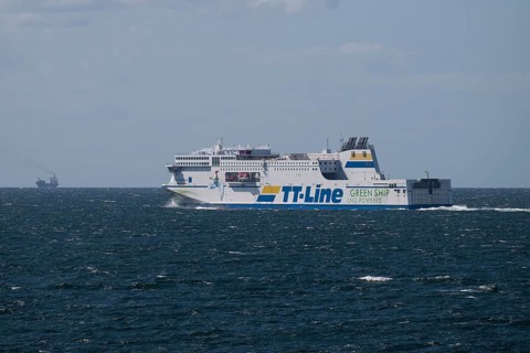 LNG-powered TT-Line ferry travelling across a gently moving blue sea, near Warnemünde, Rostock,