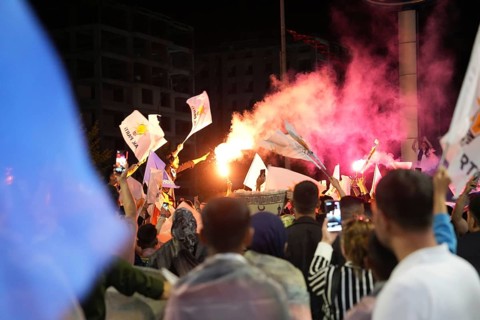Gaziantep, Türkiye – May 28, 2023. Turkish citizens wave flags of Türkiye and the ruling Justice