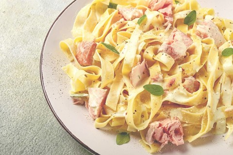 Tagliatelle pasta, in cream sauce with salmon, homemade, no people