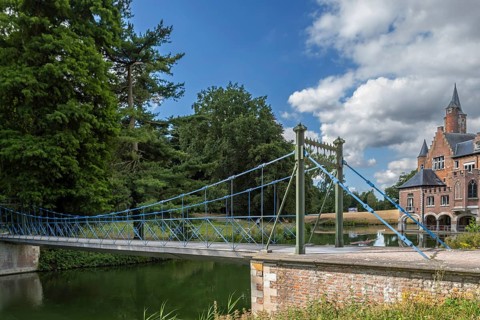 1824 iron suspension bridge in park of the Wissekerke Castle, Kasteel van Wissenkerke in the