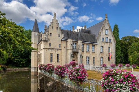 Kasteel Cortewalle, 15th century moated castle in Flemish Renaissance style at Beveren in summer,