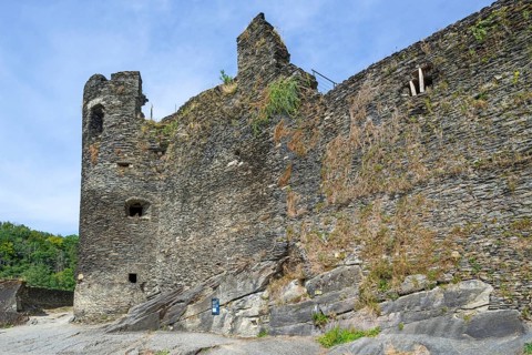 9th century medieval ruined hill castle overlooking the city La Roche-en-Ardenne in summer,