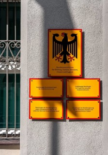 Yellow information signs, federal eagle with reference to federal ministries located there in the