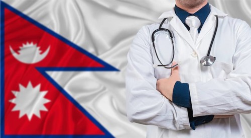 Male doctor with stethoscope on Maldivian flag. Doctor holding stethoscope on Maldives flag