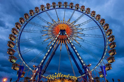 Dark clouds behind the illuminated Ferris wheel, Festwiese, Theresienwiese, Oktoberfest, Munich,