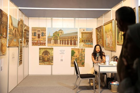 Syrian artisans display handmade artistic pieces to visitors at the Damascus International Fair.