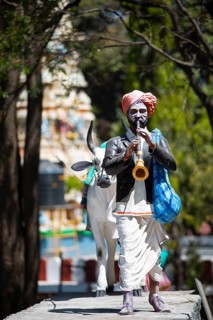Statue of a farmer playing the shenai or traditional flute at the Hindu Basavanagudi Bull Temple,