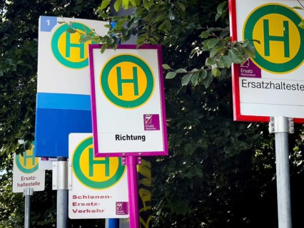 Many signs for rail replacement services due to construction work on Deutsche Bahn railway lines in