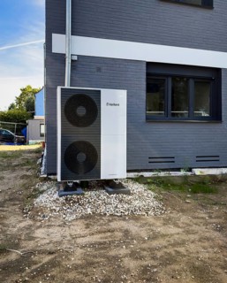 An air heat pump in the front garden of a renovated detached house in Düsseldorf, Germany