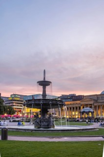 Evening atmosphere at Schlossplatz Stuttgart. View of Königstraße, art museum and Königsbau.