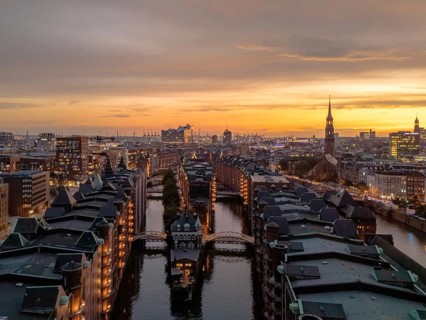 Aerial view of the Speicherstadt Hamburg with evening lighting and view over the harbour with