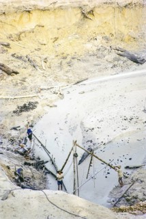 Open Cast gravel-pumping tin mine Malaya, Malaysia, south east Asia 1964 - high pressure water