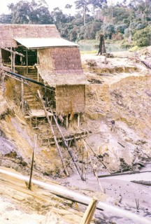 Open Cast gravel-pumping tin mine Malaya, Malaysia, south east Asia 1964 - pumping raises the