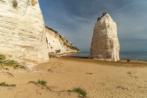 Pizzomunno rock on the Spiaggia di Castello beach in Vieste, Gargano, Apulia, Italy