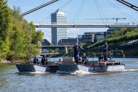 Exercise run of a multi-purpose pontoon on the Rhine, Medienhafen, the skipper gives instructions