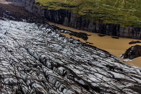 Icebergs, ice floes, glacier tongue, glacier edge, glacier, glacier lagoon, aerial view, black ice,