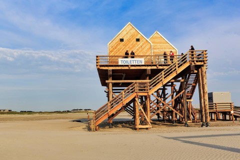Pile dwelling, toilet house on the beach, walker, Sankt Peter-Ording, Eiderstedt peninsula, Wadden