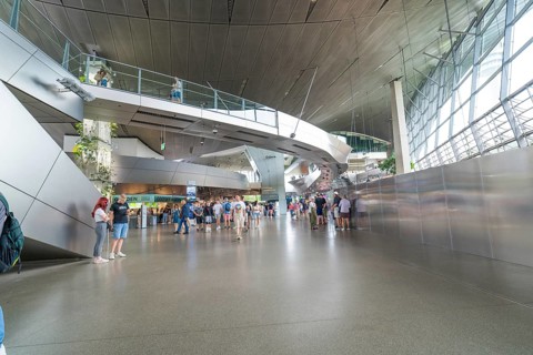Futuristic interior with lots of people and modern architecture, BMW Welt, Munich, Germany