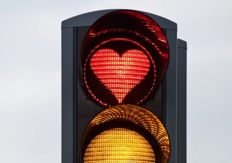Traffic light with red light in the shape of a heart, Akureyri, North Iceland, Iceland