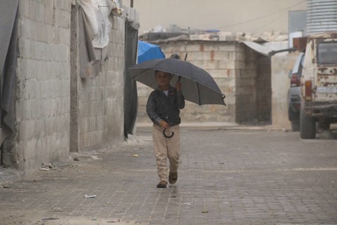 Syrian children playing in a refugee camp near the Turkish border on World Children's Day. Aleppo,