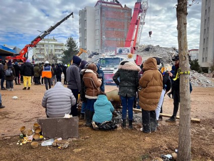 Turkish civil defense teams (AFAD) search for survivors under the rubble after a powerful 7