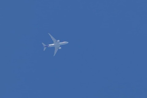 Airbus A300-600RF jet aircraft of FedEx Express airlines in flight in a blue sky, England, United