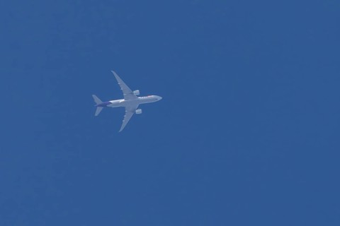 Airbus A300-600RF jet aircraft of FedEx Express airlines in flight in a blue sky, England, United