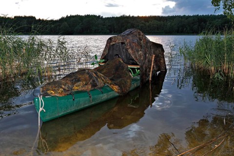 Kayak of a nature photographer in the water, Müritz National Park, Mecklenburg-Western Pomerania,