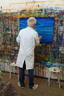 Painting a picture in the studio, Germany