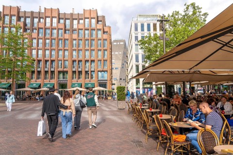 The Grote Markt in the old town of Groningen, modern facades of hotel and commercial buildings, in