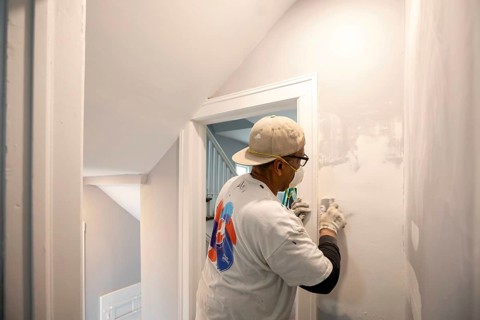 Detroit, Michigan - Workers remodel a house in the Morningside neighborhood that had been vacant
