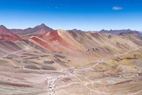 Vinicunca, colourful mountains in the background, in the Peruvian Andes, Cusipata district, Cusco,