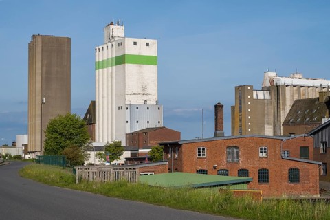 Grain silos, warehouses, land trade, outer harbour, Husum, North Frisia, North Sea,