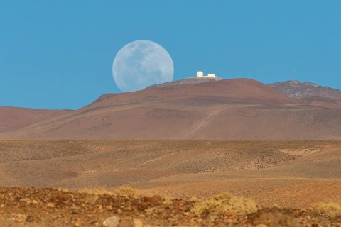 An observatory on a mountain next to the rising full moon, San Pedro de Atacama, San Pedro de