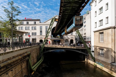 The Wuppertal suspension railway arrives at the Döppersberg stop in the city centre of Wuppertal,