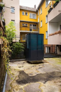 Heat pump in a backyard in Wuppertal, Germany, digitally reworked