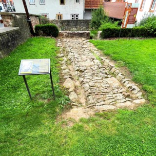 Archaeological find of original small section with old stones from historic trade route between