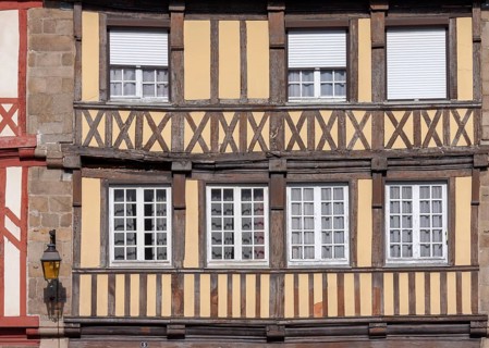 Close-up of a half-timbered house with beige and brown elements, Tréguier, Brittany, France