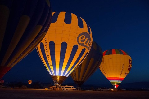 Hot air balloons at night with colourful lighting, creating a fascinating and atmospheric ambience,