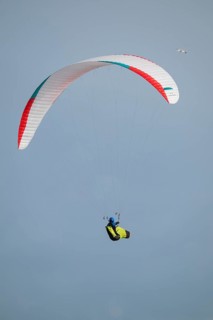 A paraglider or paraglider in front of a blue sky, near Hvide Sande, North Sea, Denmark