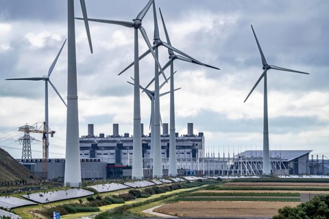 Wind turbines of a wind farm near Eemshaven, behind the Eemscentrale gas and steam power station,