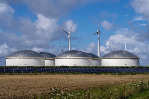Wind turbines of a wind farm near Eemshaven, VOPAK tank farm, solar plant, Netherlands