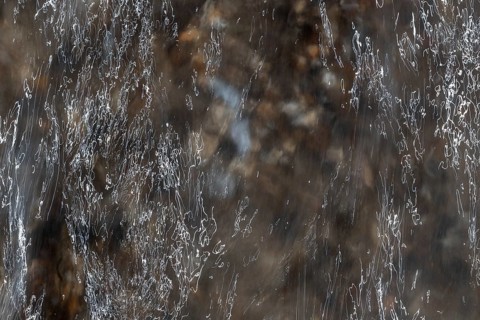 Close-up of moving water with a pattern of light and shadow, long exposure, North Sea, Denmark