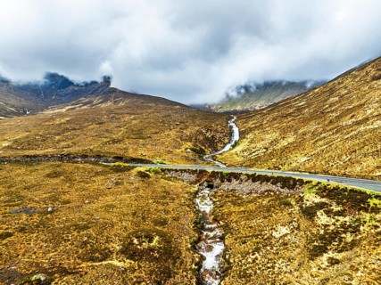 Eas a' Bhradain Waterfall from drone, Red Cuillin mountains, Loch Ainort, Isle of Skye, Scotland,