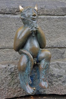 Sculpture Devil by Rolf Goerler 1999 sitting on the Devil's Stone, bronze sculpture, modern art, St