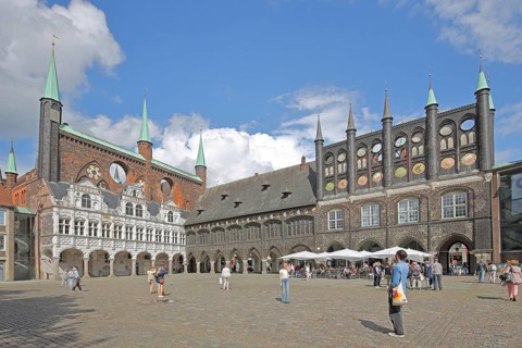 Renaissance and Gothic town hall and pedestrians, tourists, Brick Gothic, brick buildings, market,